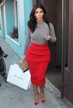 Kim Kardashian combines a grey longsleeve with a beautiful red skirt.: High-Low Skirt,  Long Sleeve  