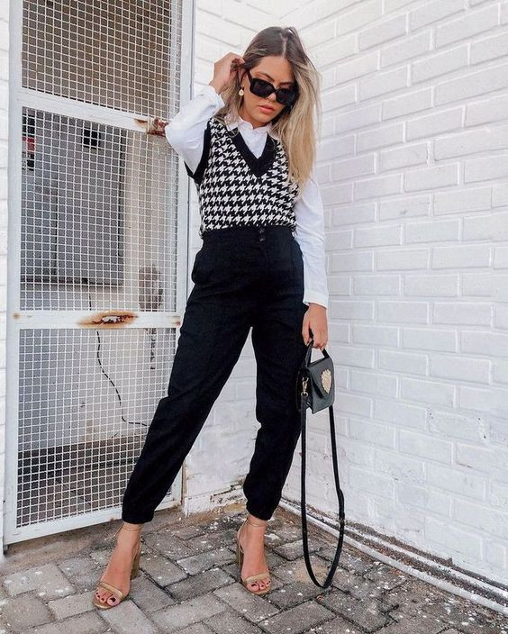 Back to business in black and white with a sweater vest ensemble that means business